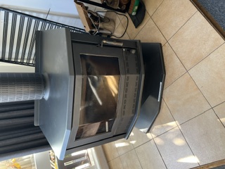Large Coonara combustion wood heater in the main lounge